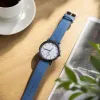A simple quartz watch for men with a blue strap and a genuine leather strap, water-resistant to 30 meters details Picture